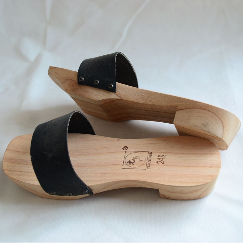 green wooden clogs