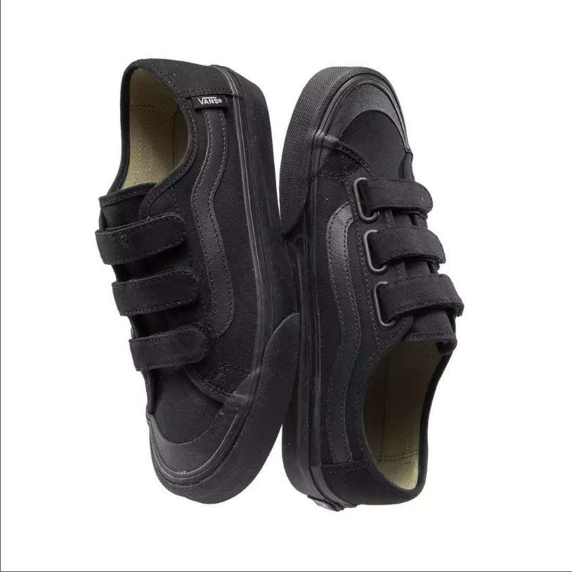 all black vans with straps