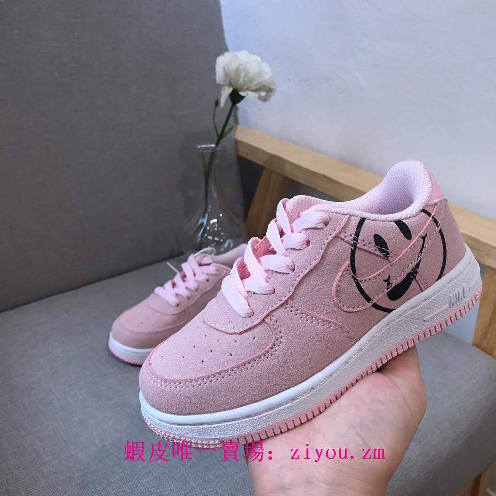 pink air forces with smiley face