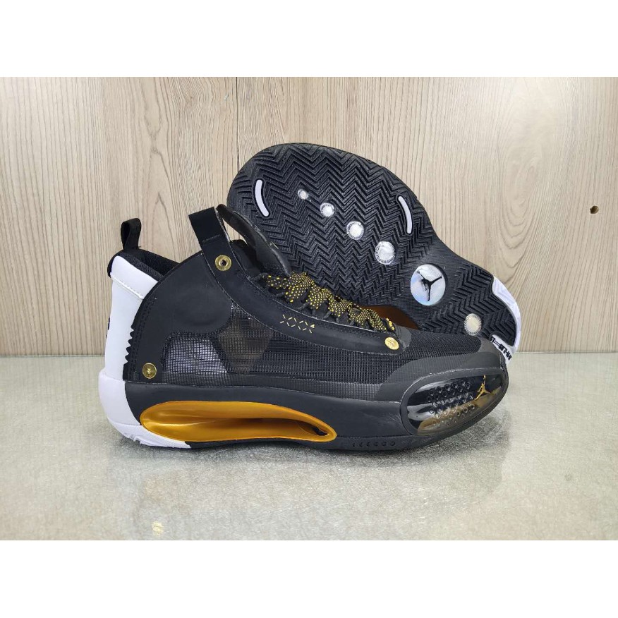 black and gold training shoes