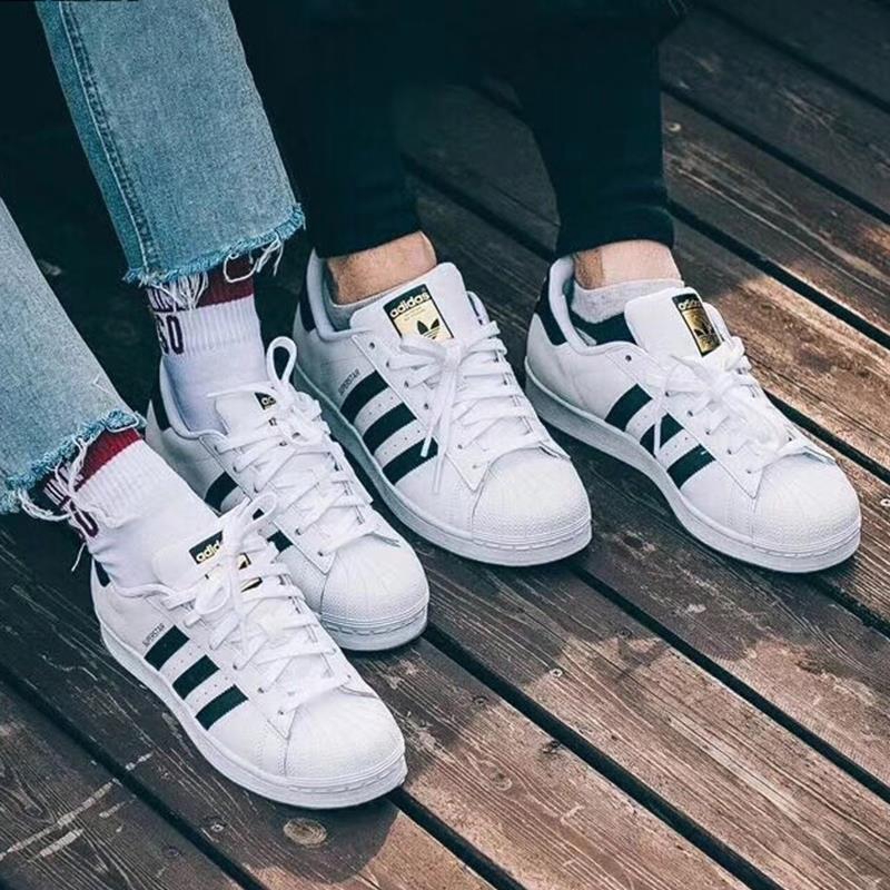 couple shoes adidas white