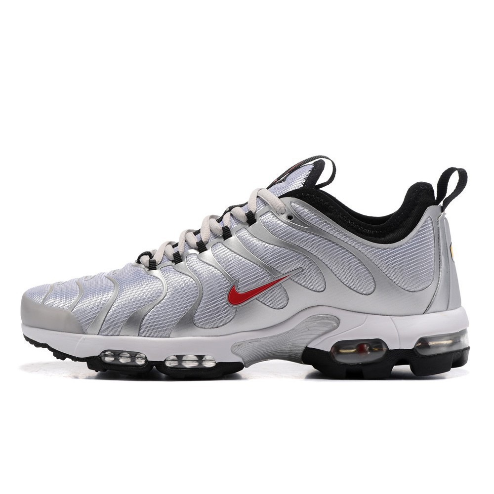 white and silver air max plus