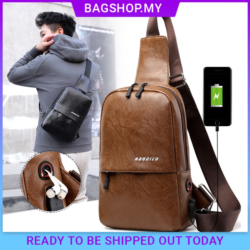 man with leather bag