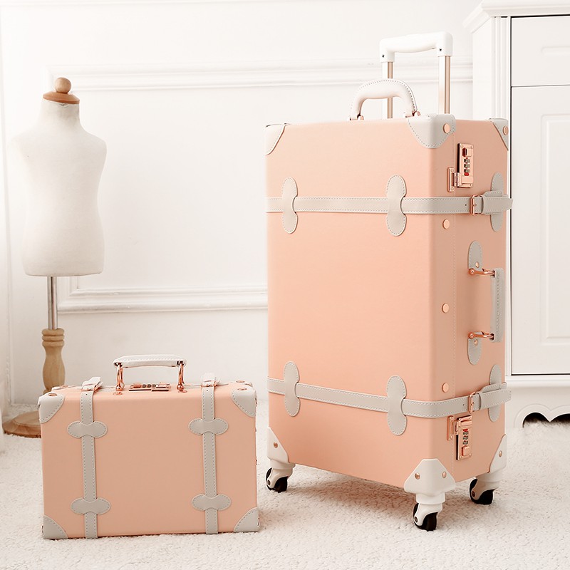 light pink luggage