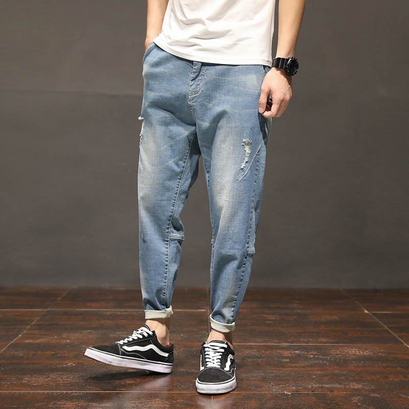 men's light colored ripped jeans