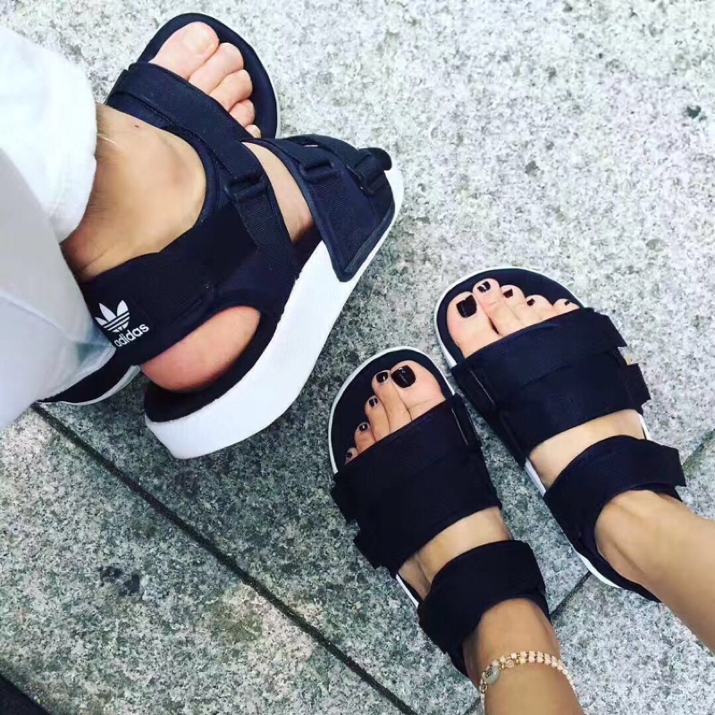adidas adilette sandals on feet