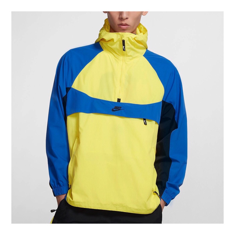 yellow white and blue nike windbreaker