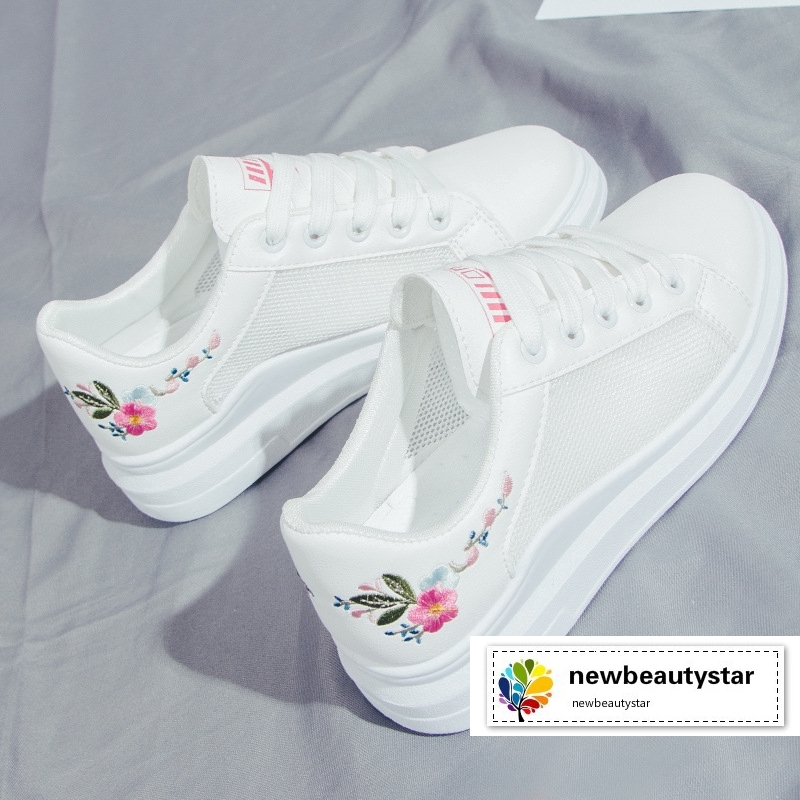white shoes with flower embroidery