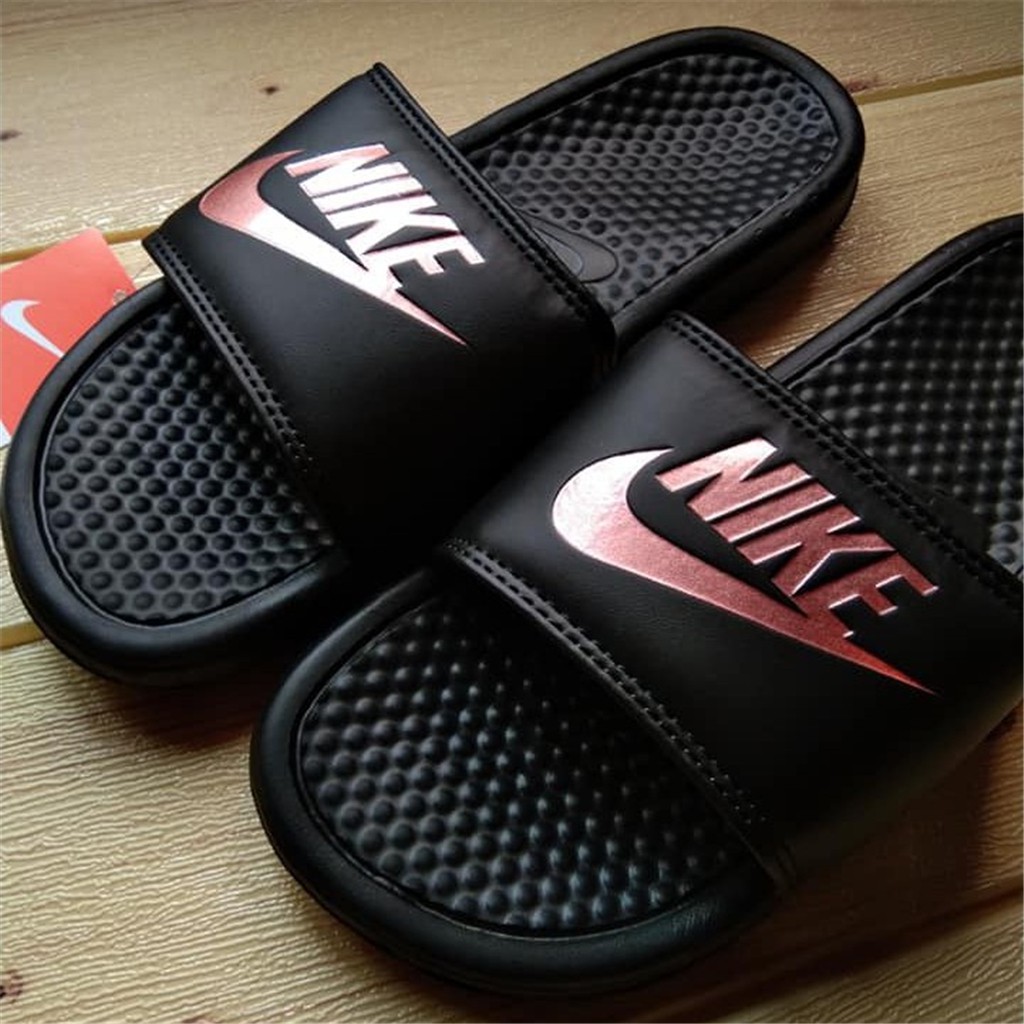 red and black nike slippers