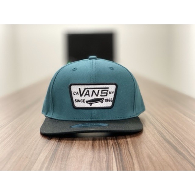topi vans off the wall