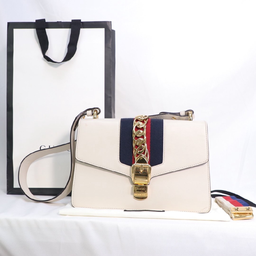 white and gold shoulder bag