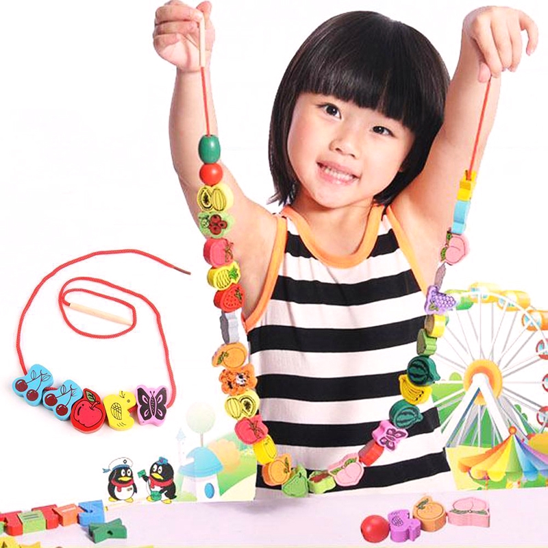 child threading beads