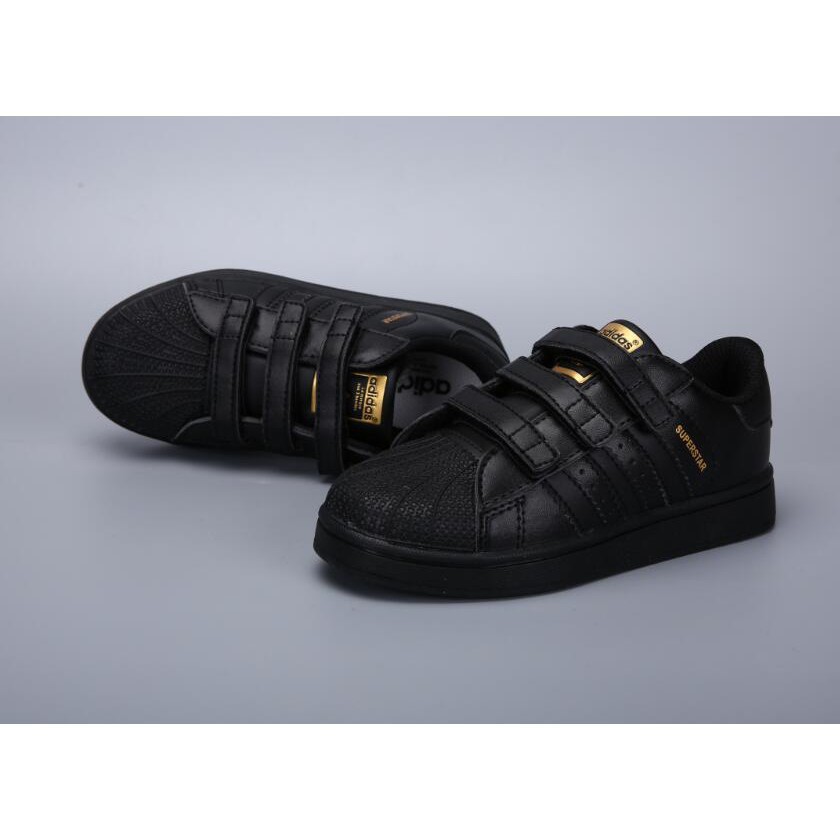 black and gold infant shoes