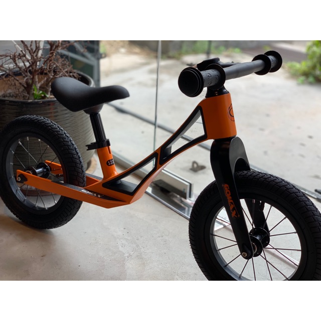 orange push bike