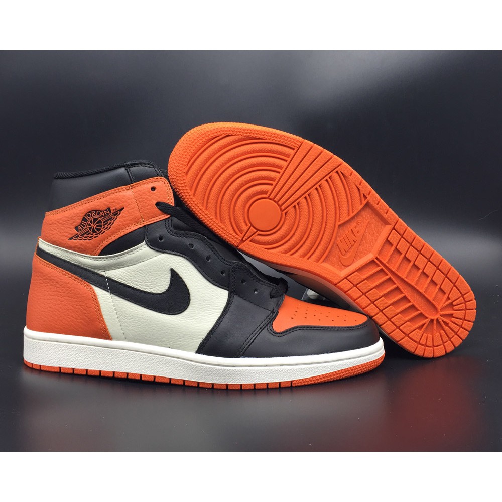 orange and black jordan 1s