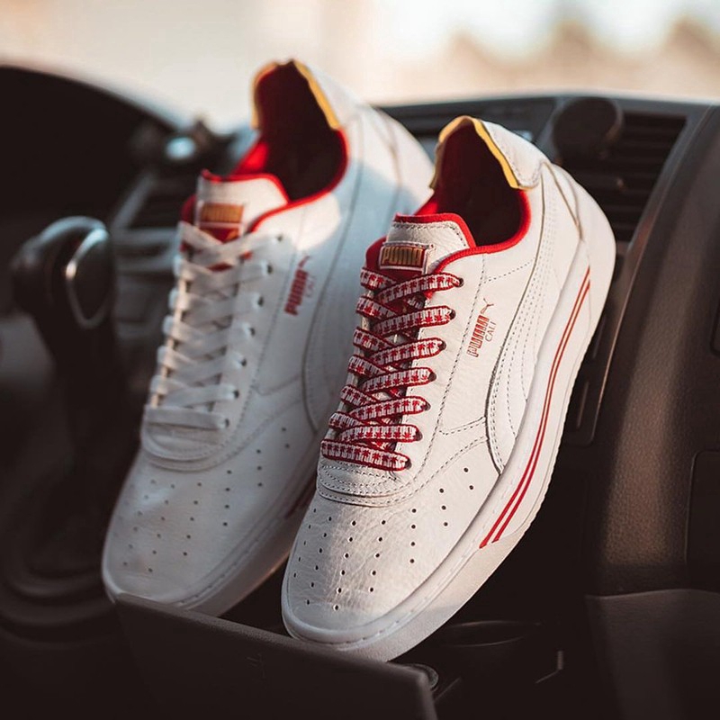 all white low top pumas