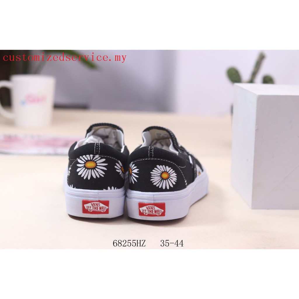 vans era big daisies