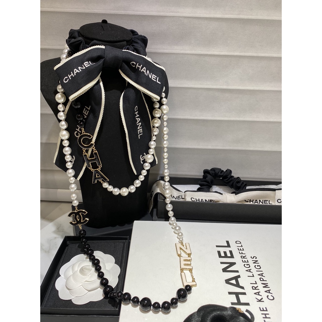 Chanel black and white letters pearl necklace sweater chain 22a senior  panda color sweater chain handmade | Shopee Malaysia