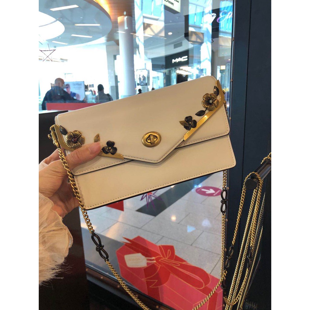 coach aster crossbody with floral frame