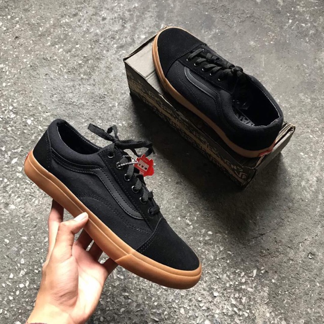 all black vans with gum sole