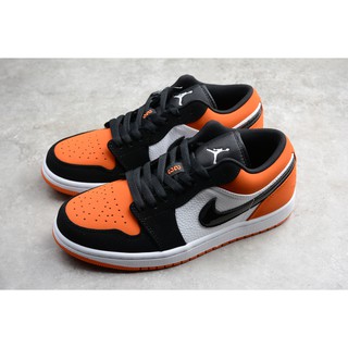 black and orange jordan 1 low