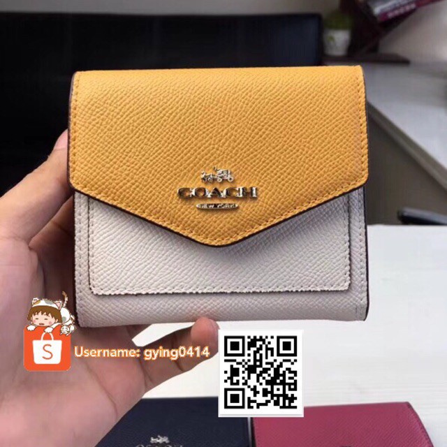 small yellow coach purse