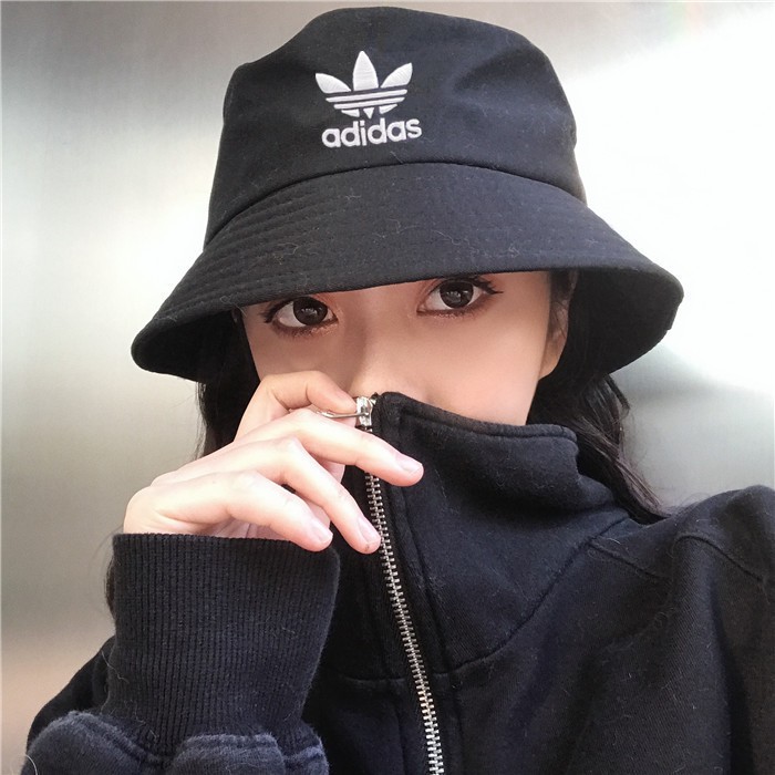 girl with adidas cap