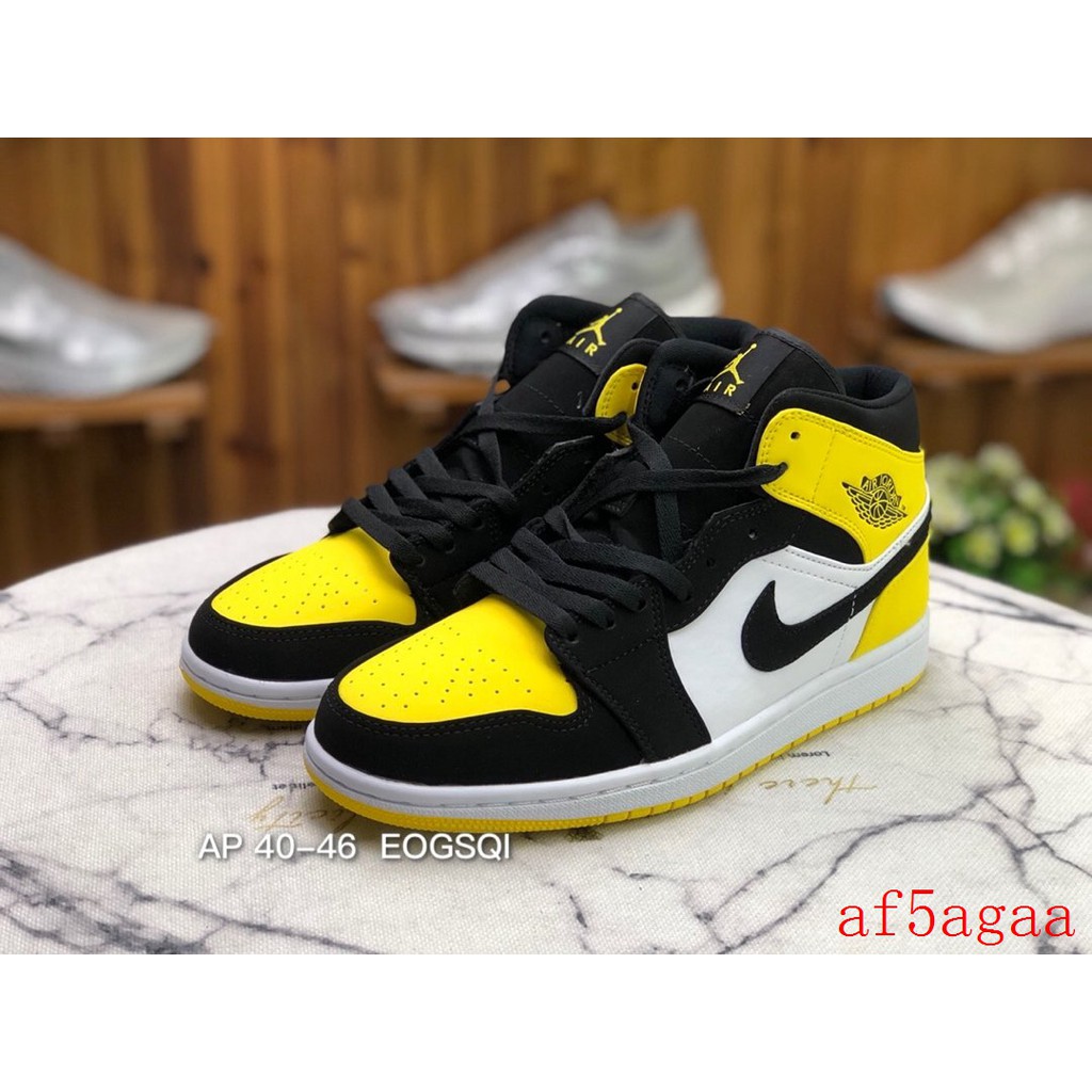 black and yellow mid jordan 1s