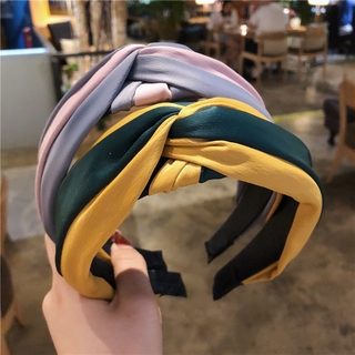 The new Korean version of wide-brimmed hairband color matching fabric is cross-knotted, and the hair accessories of hairband Hair Grottoes manufacturers are sent on behalf of each other