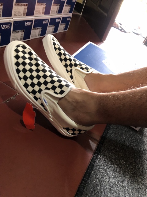 vans slip on checkerboard on feet