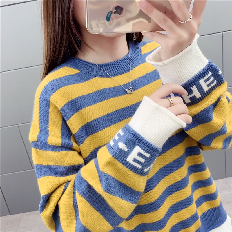 green sweater with yellow stripe