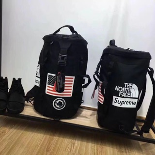 north face and supreme bag