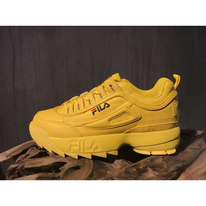 all yellow fila shoes