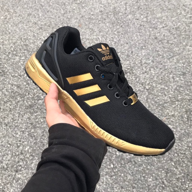 zx flux black and gold