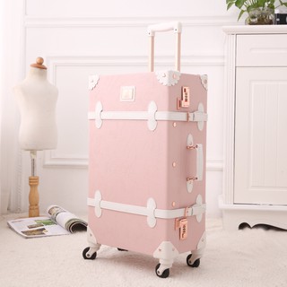 light pink suitcase