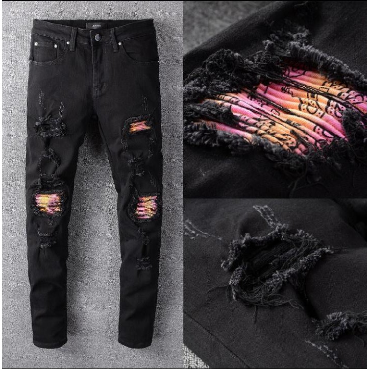 black amiri jeans with patches