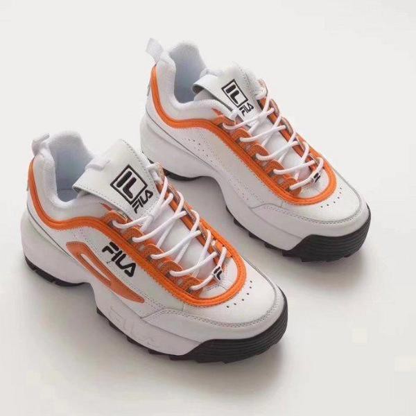 white and orange fila disruptor