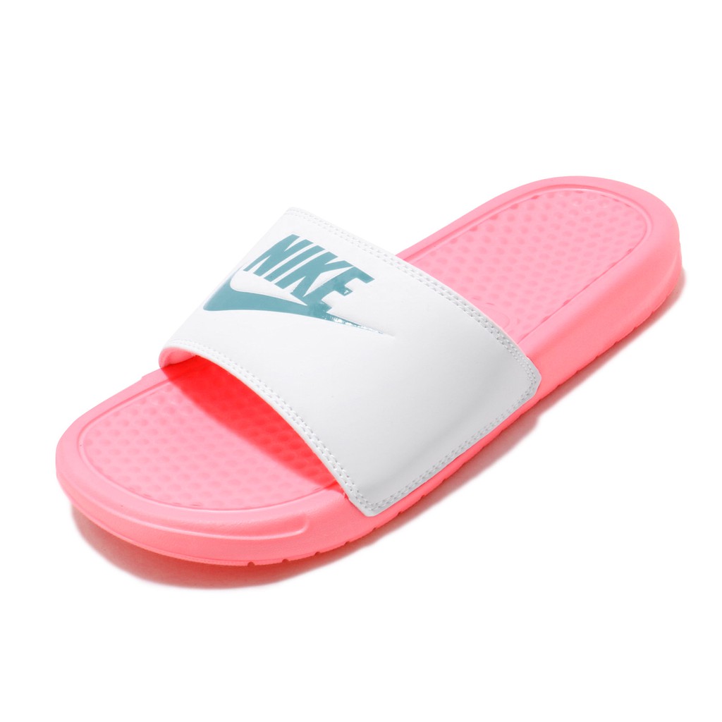 pink and white nike flip flops