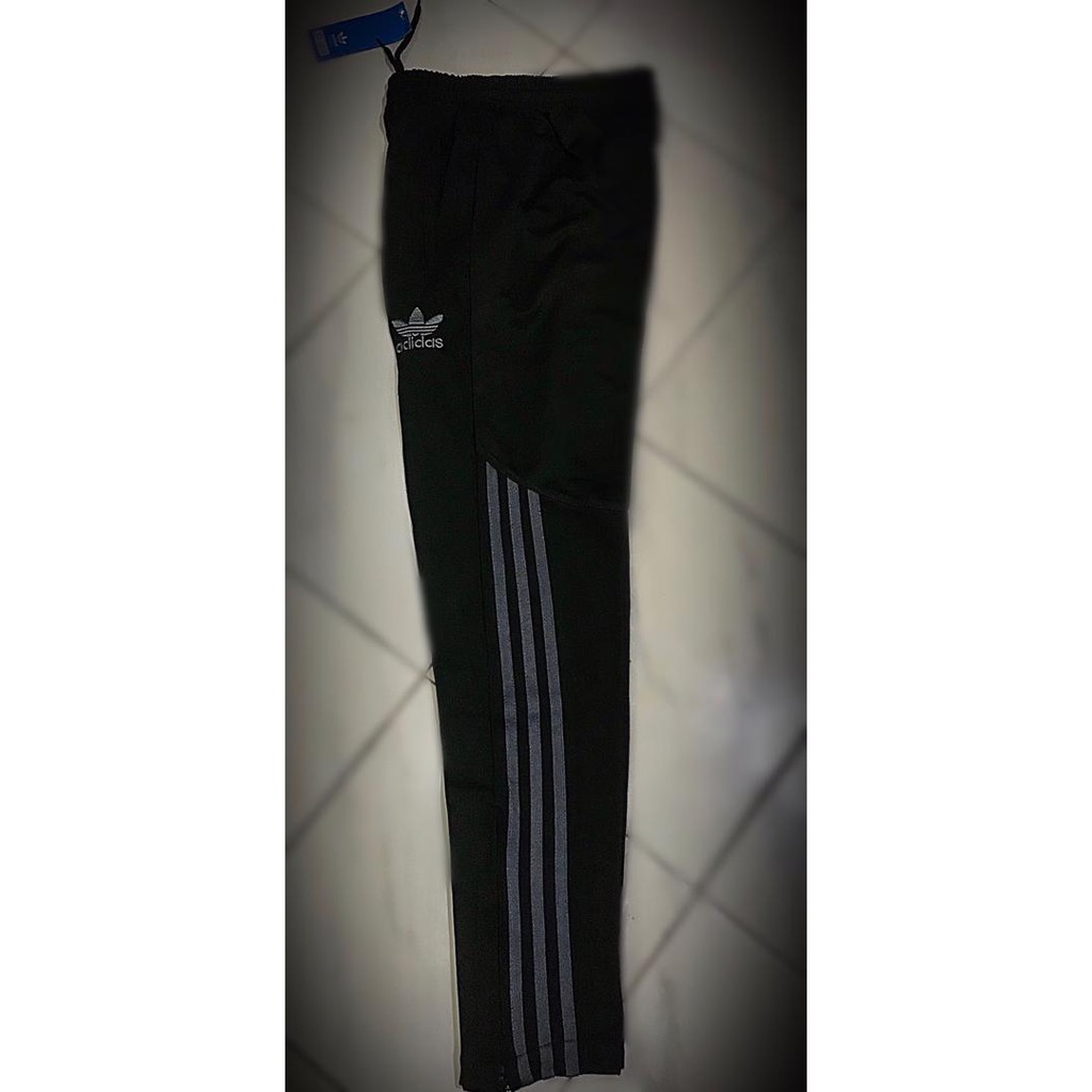 half striped adidas pants