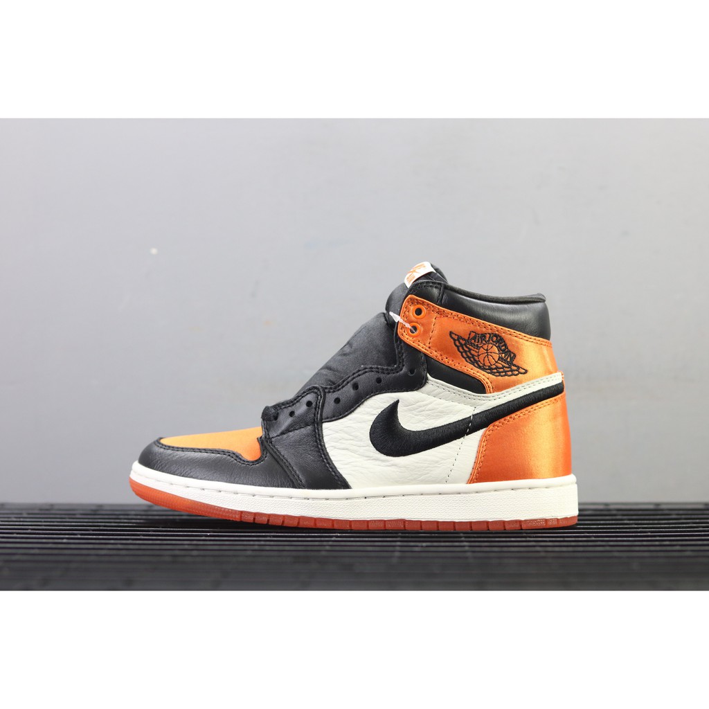 black orange and white jordan 1s