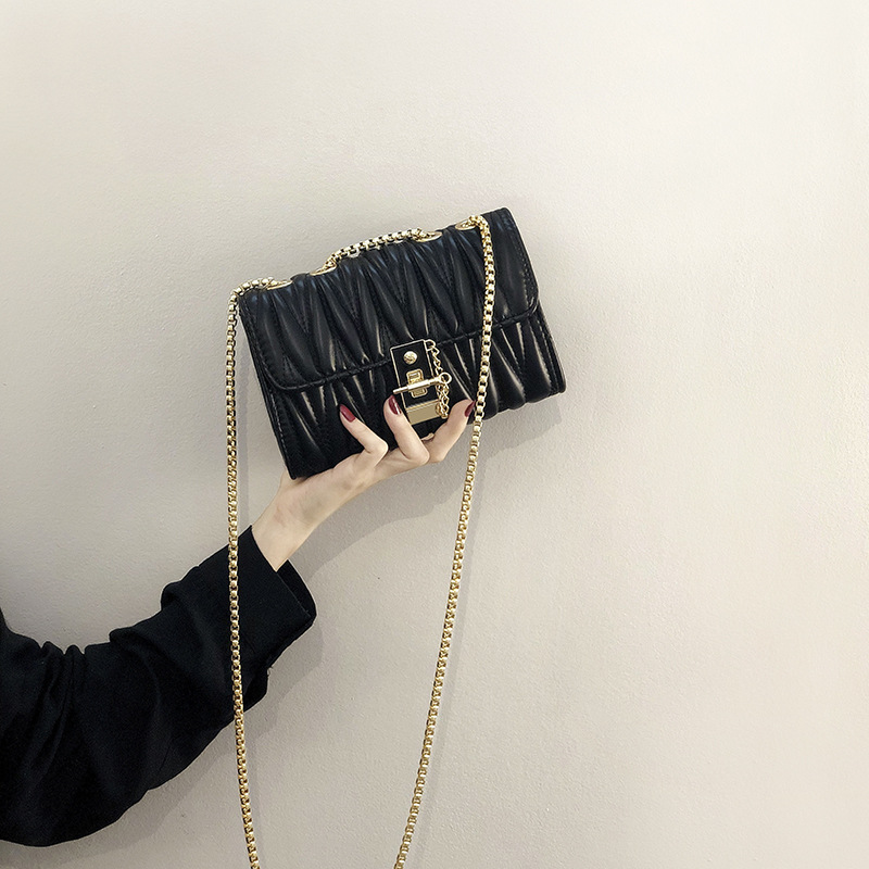 black sling bag with gold chain