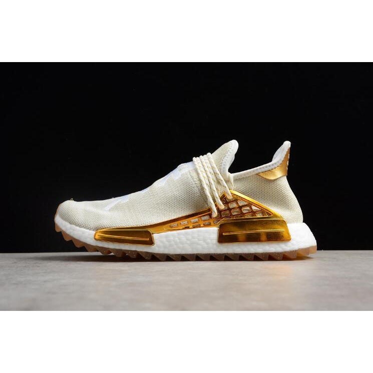 human race shoes mens gold