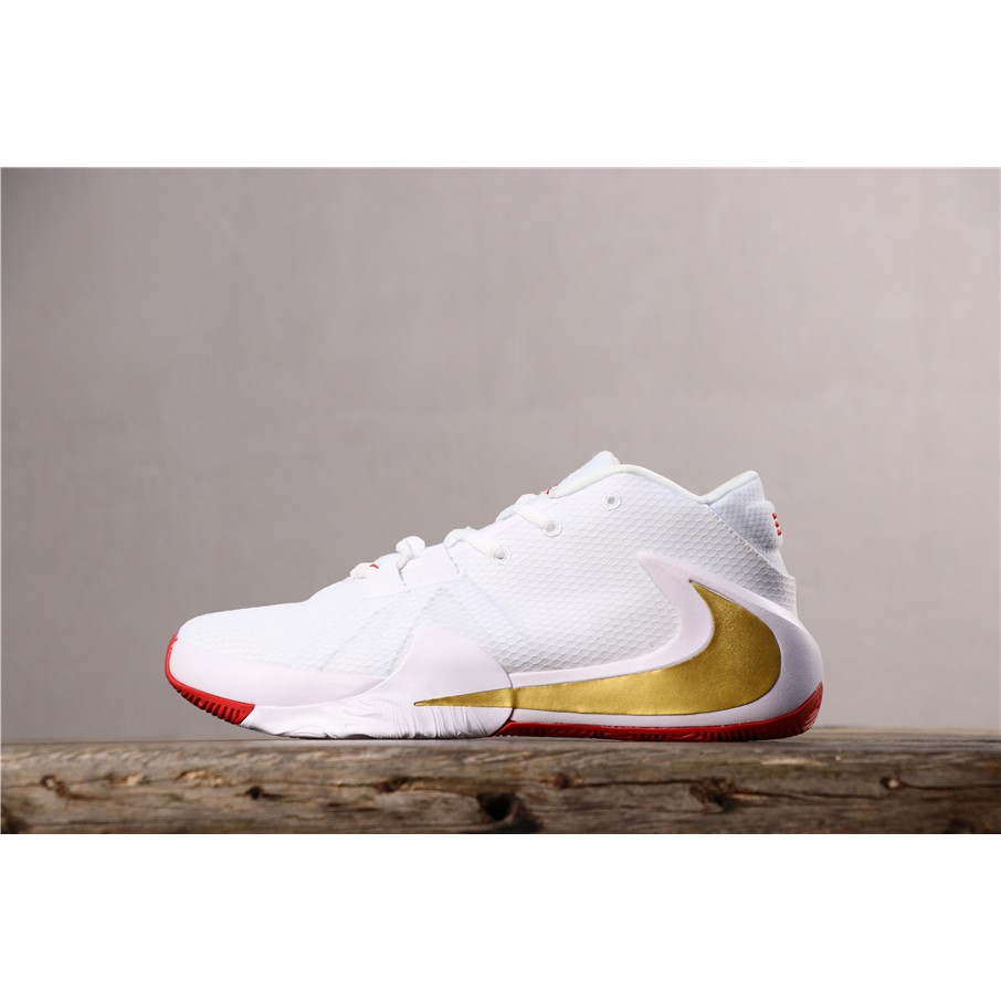 white and gold nike basketball shoes