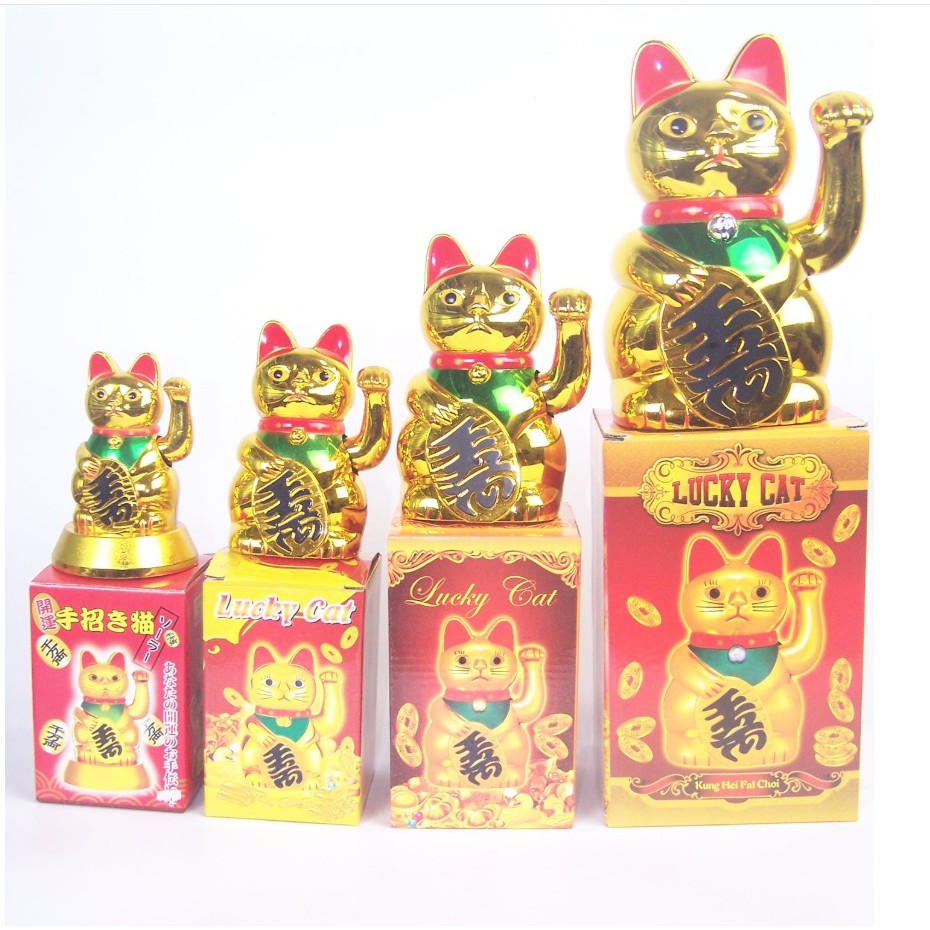 gold cat with waving arm