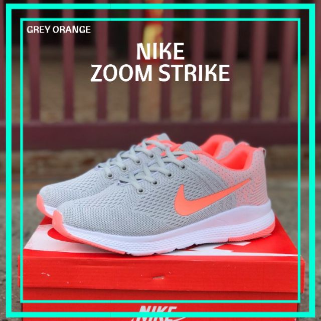nike shoes grey with orange