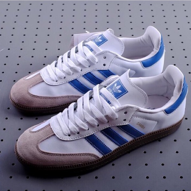 white and blue adidas samba