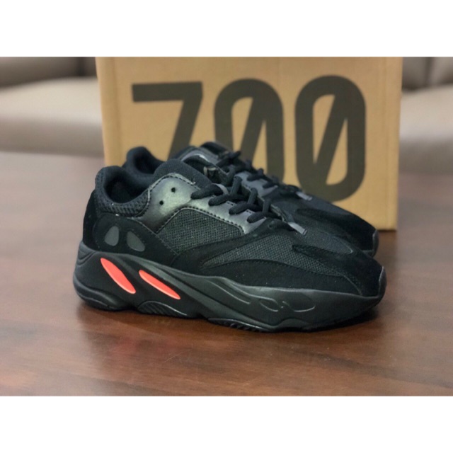 black and orange yeezy 700