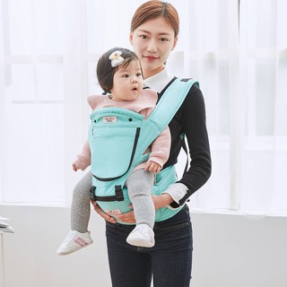 baby holding backpack