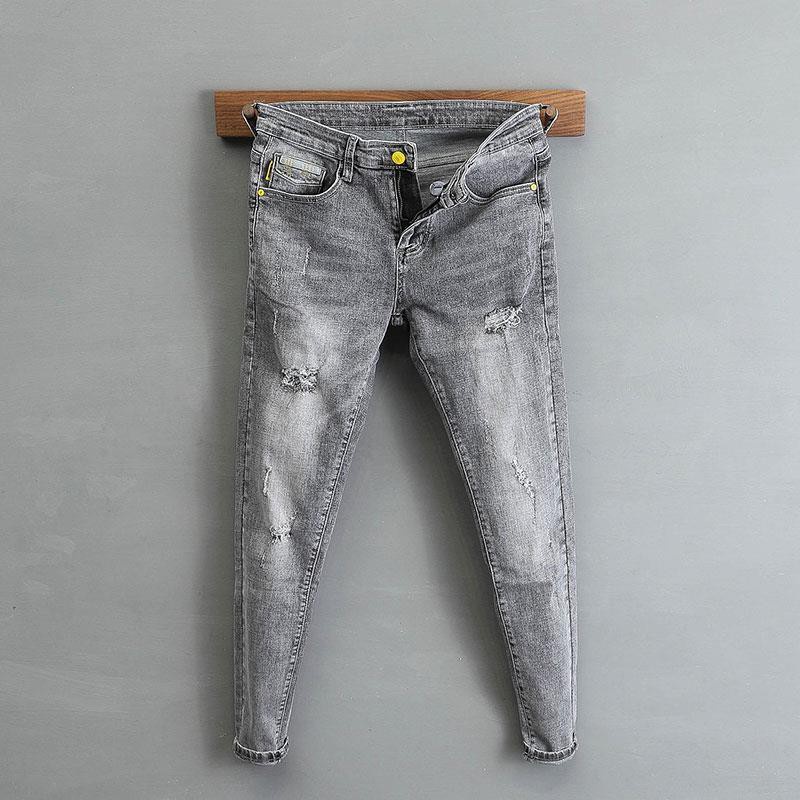 Versi Korea celana kelabu kaki bersifat pribadi seluar lelaki Leggings fashion pemuda hairstylist jeans brand Korean version gray ragged pants leg personalized men's young men