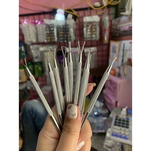 Nail polish scraper
